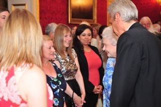 Sandra Met HM Queen Elizabeth
